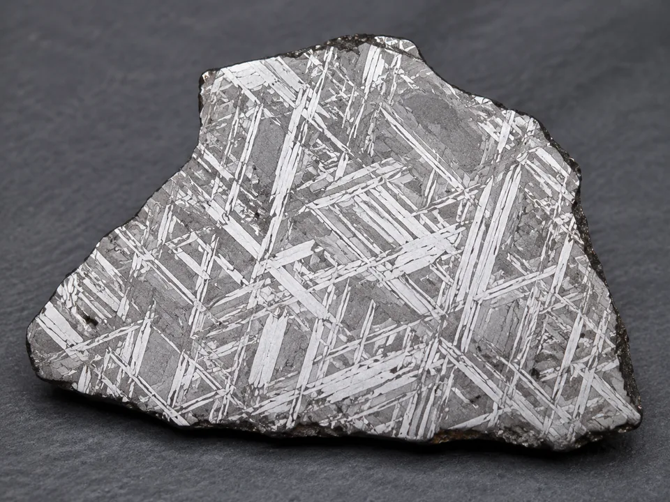 Gibeon Iron Meteorite specimen photograph on a neutral background.
